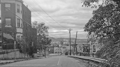 Black and white image of an empty street