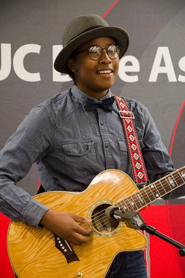 Hawa Tarawally playing a guitar