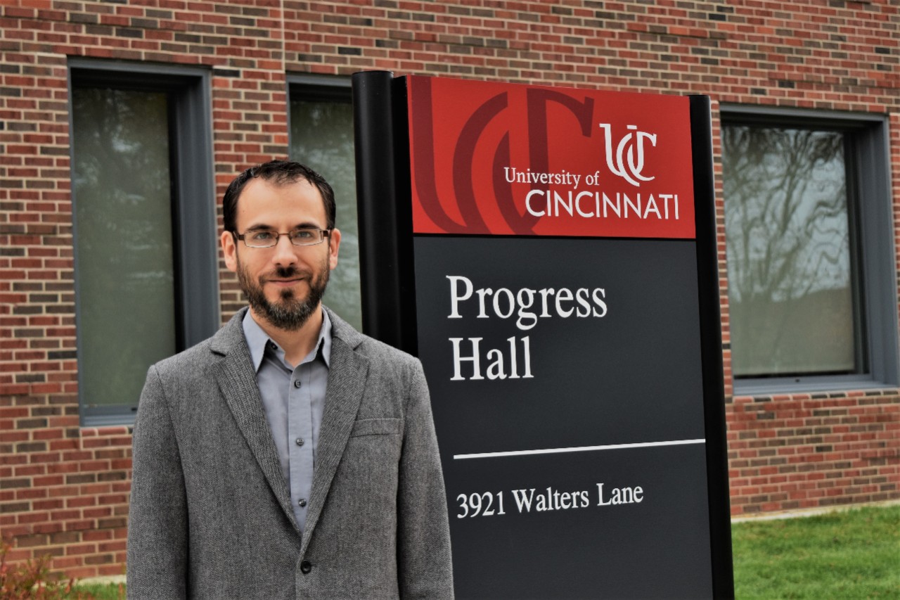 Kevin Oberlin in front of Progress Hall