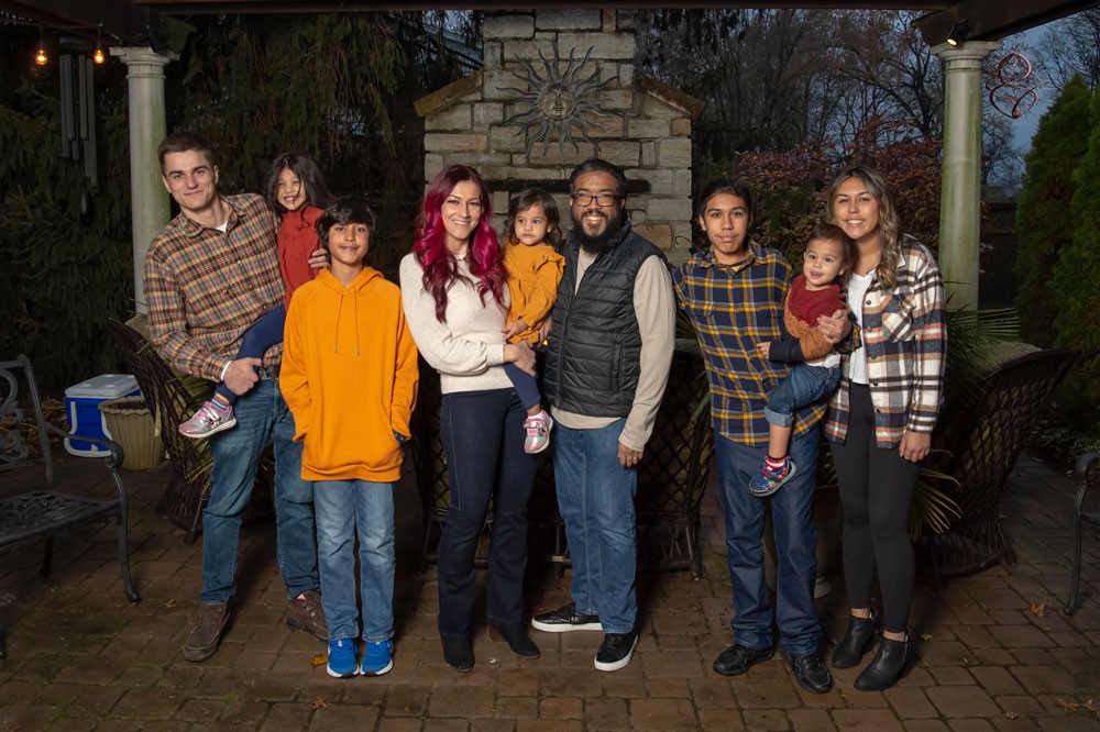 Ranjiv and family posing outdoors