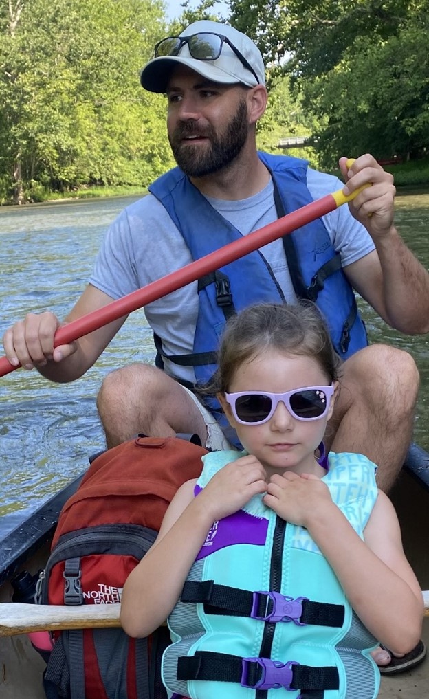 Clay kayaking with his daughter