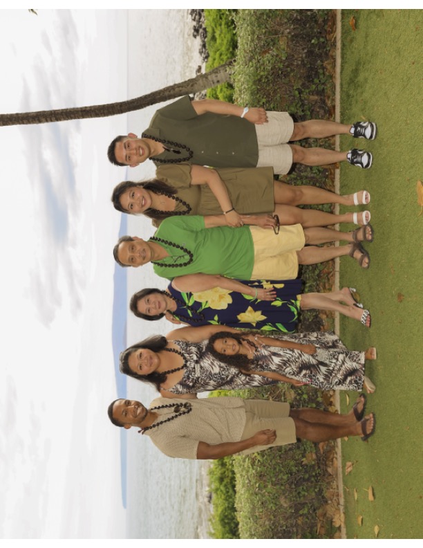 family group posing at beach