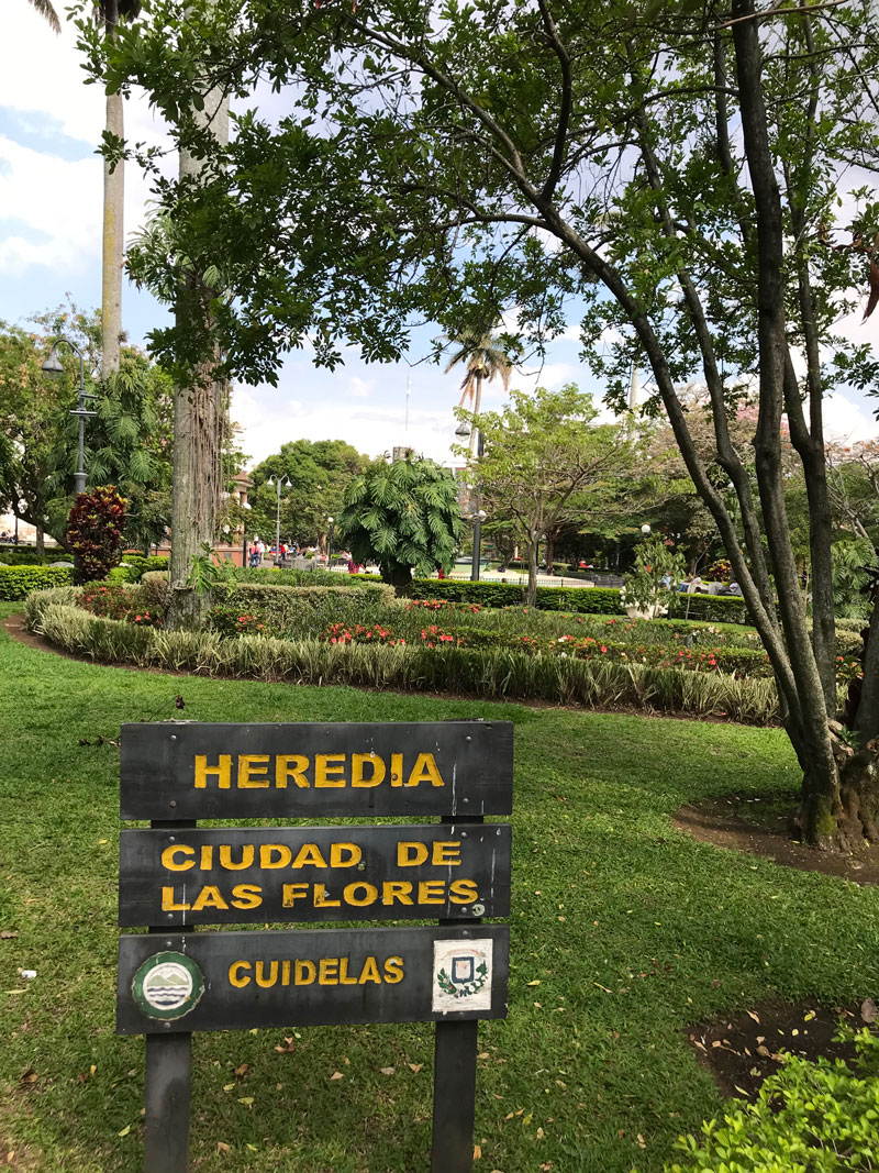 City of Flowers sign in Costa Rican garden