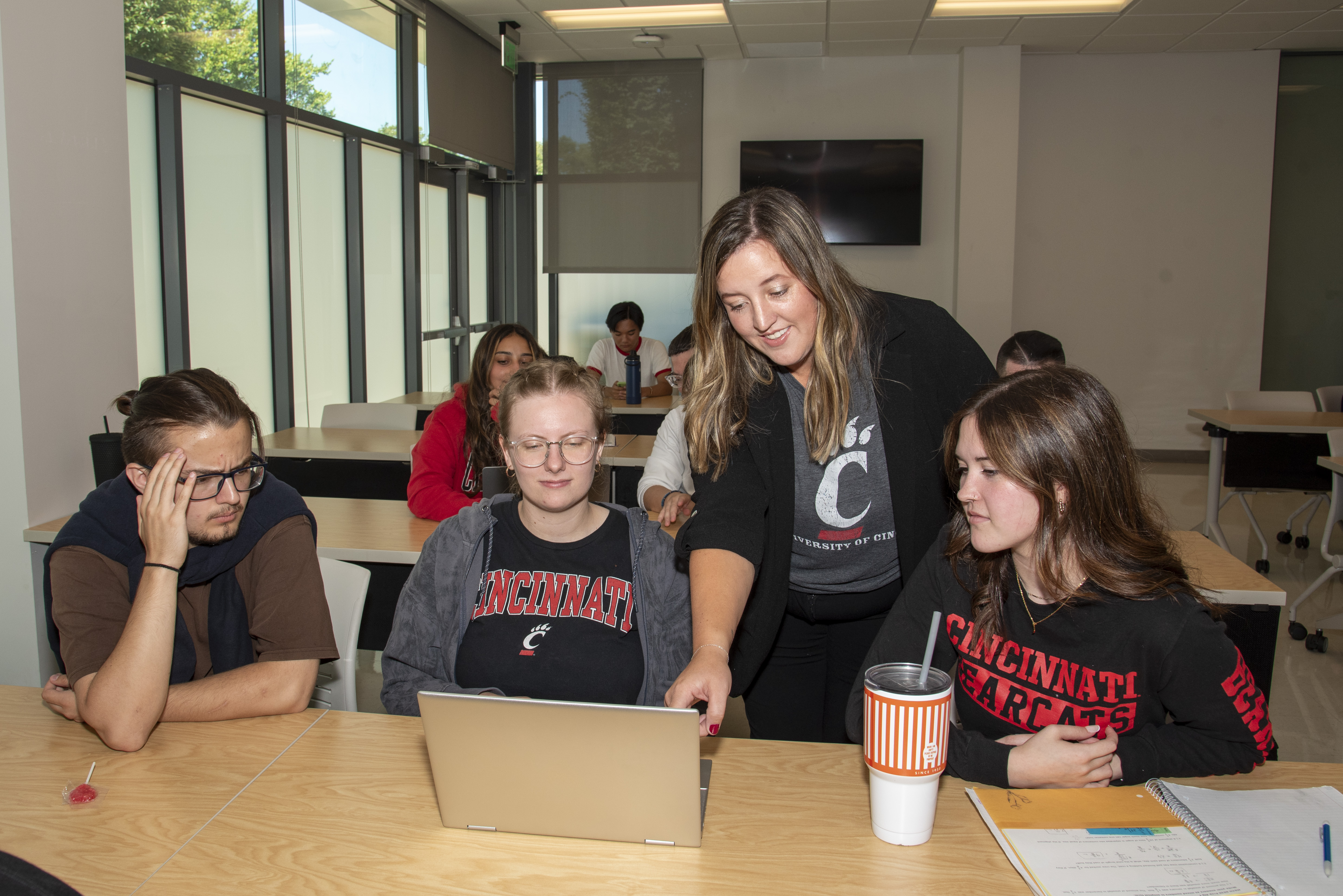 Kelsi Becker with student in class