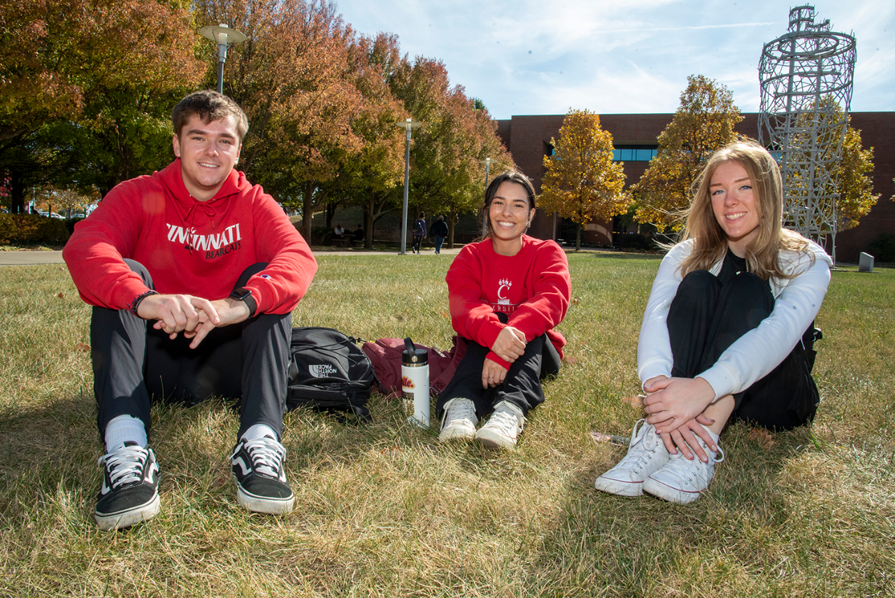 three UC Blue Ash students enjoy the UC Blue Ash campus quad