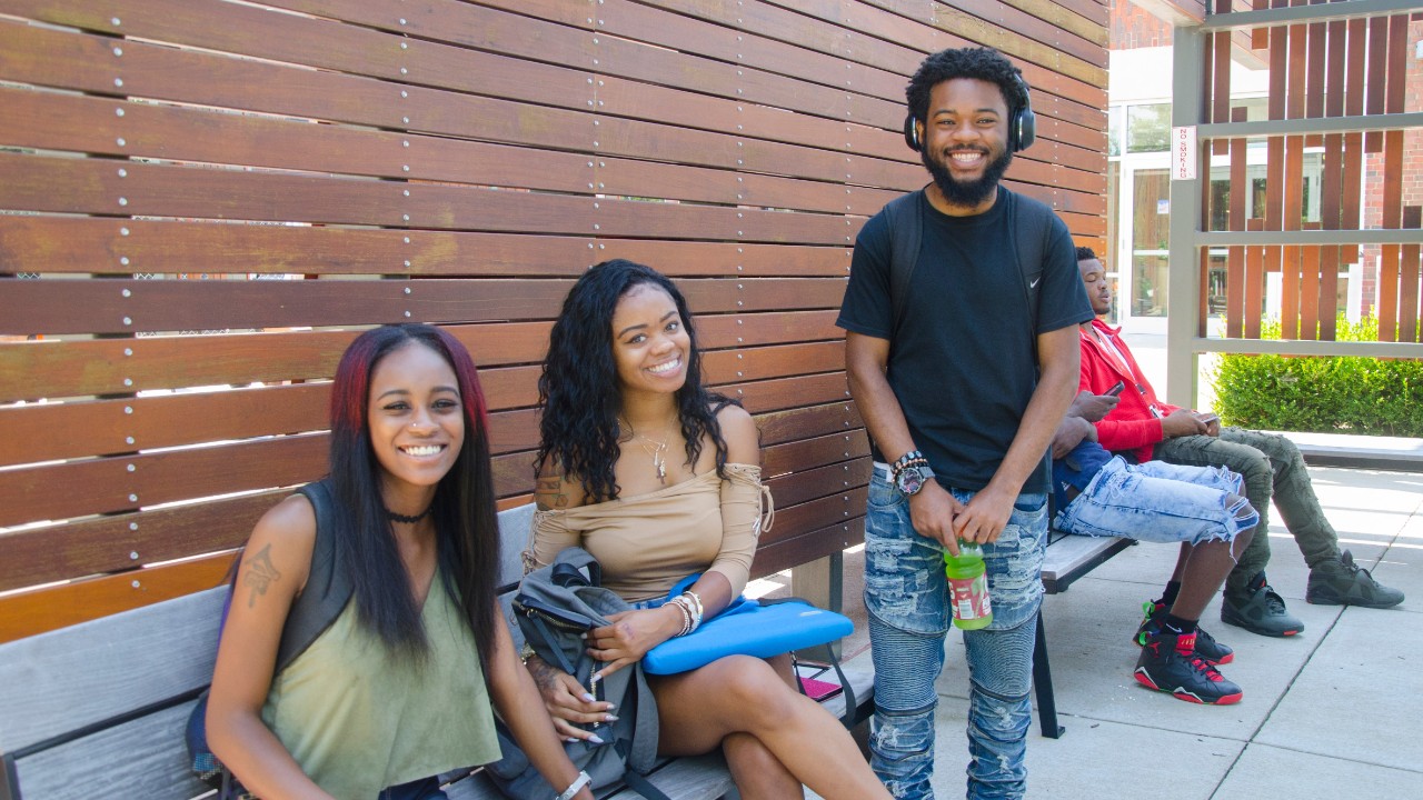 Group of students enjoying outside patio Muntz Hall at UC Blue Ash College